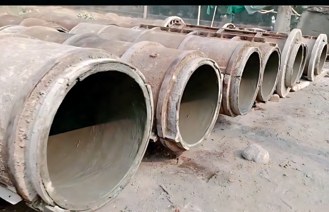Rows of curing RCC pipes at the factory
